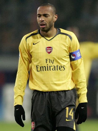 Arsenal captain, Thierry Henry, suffers during defeat in Moscow