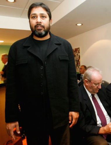 The Pakistan captain arrives at the ICC hearing, also attended by umpire Darrell Hair (seated)