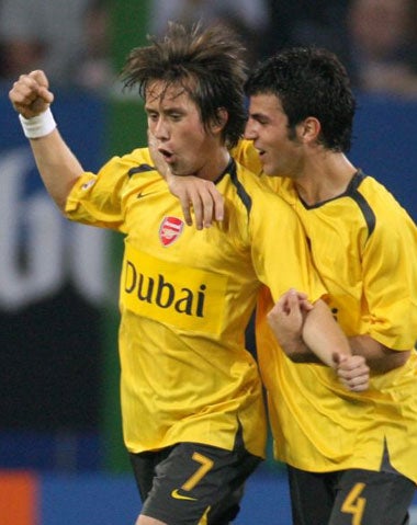 Rosicky (No 7) and Fabregas celebrate Arsenal's second goal