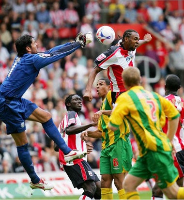 Goalkeeper Pascal Zuberbuhler denies Saint's John Viafara