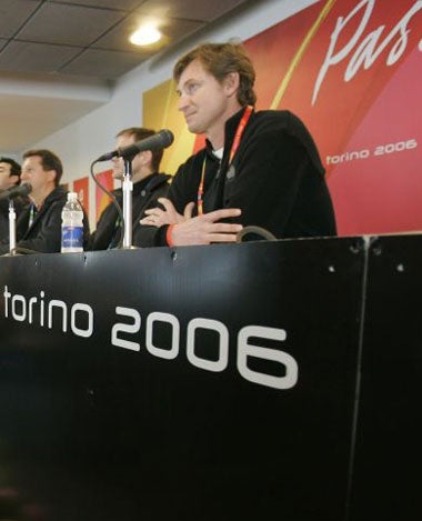 Gretzky faces the media after ice hockey practice in Turin