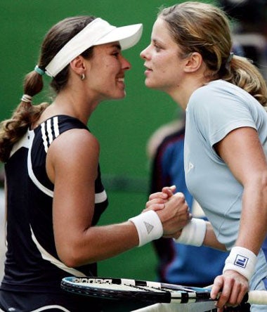 Hingis congratulates Clijsters (right) after losing 6-3, 2-6, 6-4