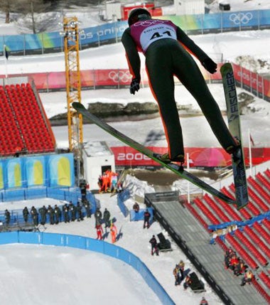 Austrian Felix Gottwald soars above the Olympic ski jumping stadium during practice