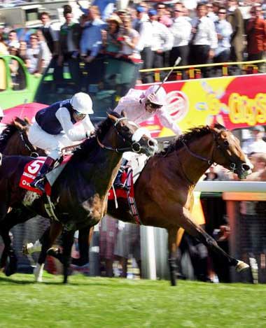 Martin Dwyer (pink silks) wins the Derby by a short-head