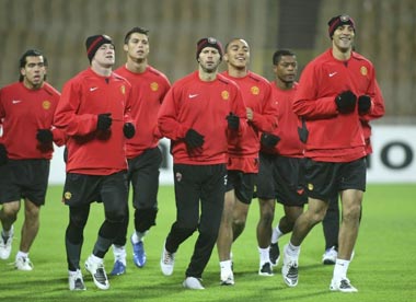 Manchester United players training at the Olympic Stadium last night