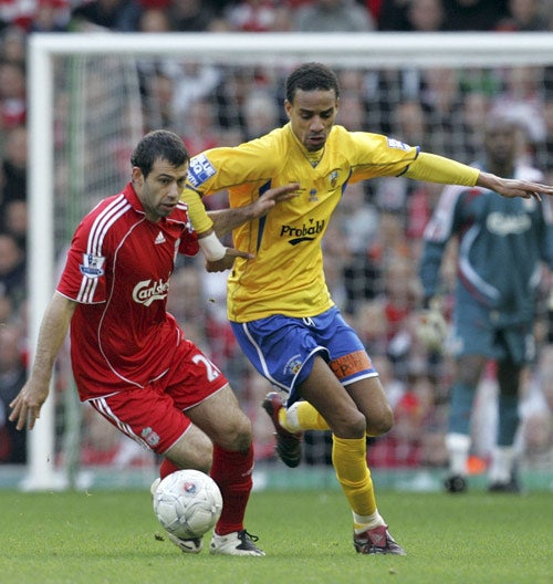 Havant's Rocky Baptiste tussles with Liverpool's Javier Mascherano