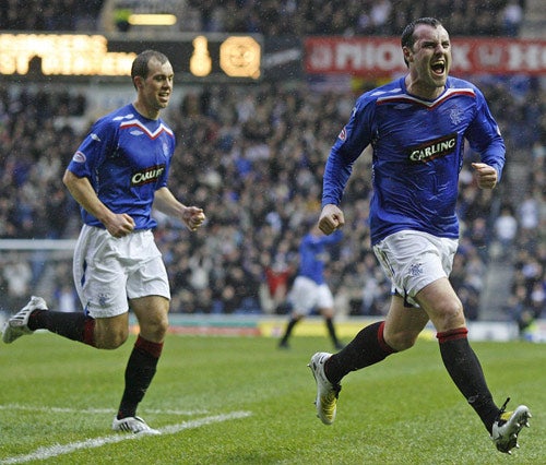 Kris Boyd (right) celebrates a goal with fellow scorer Steven Whittaker