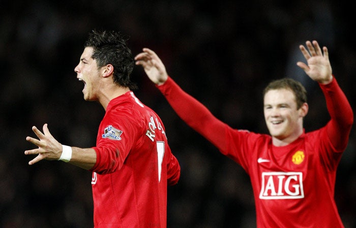 Ronaldo celebrates last night with team mate Wayne Rooney