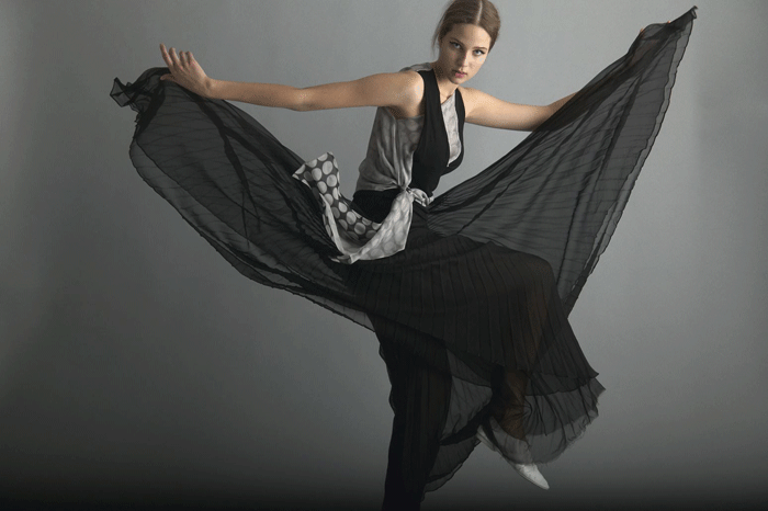 Chalayan's priority remains making clothes that are pleasing to wear, such as this black polka-dot top and pleated black skirt. © Pete Drinkell