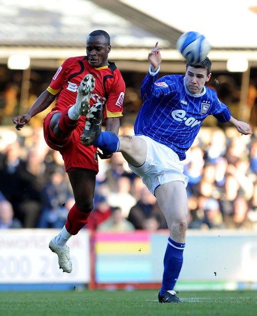 Watford's Al Bangura and Ipswich's Owen Garvan battle for the ball at Portman Road