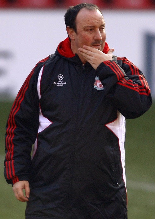 Rafael Benitez watches his side training at Anfield yesterday ahead of tonight's Champions League meeting with the Italian giants Internazionale