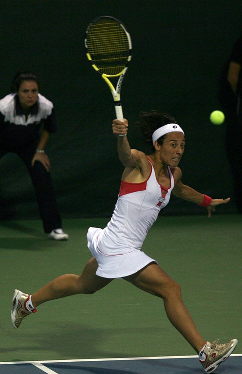 Francesca Schiavone returns the ball during her impressive victory over Justine Henin