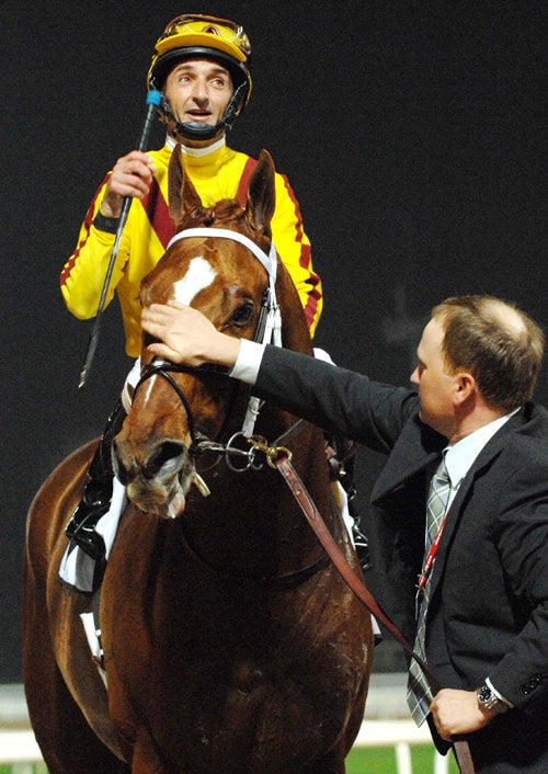 Robbie Albarado aboard Curlin after their victory in Dubai
