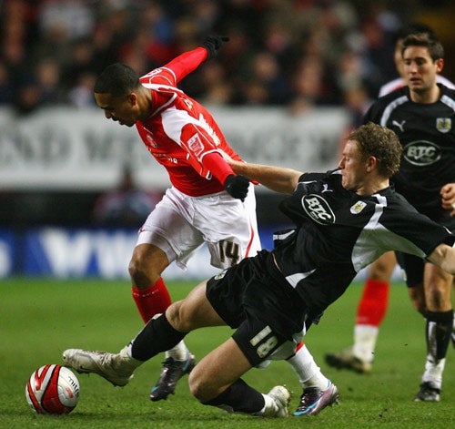 Brian Wilson of Bristol City battles for the ball with Charlton's Jerome Thomas