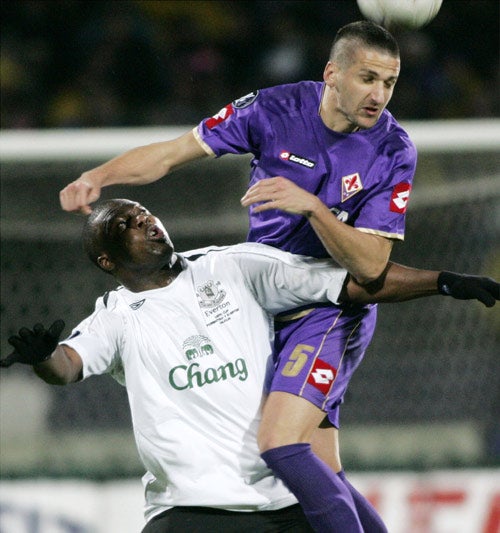 Fiorentina's Alessandro Gamberini outjumps Everton's Yakubu last night