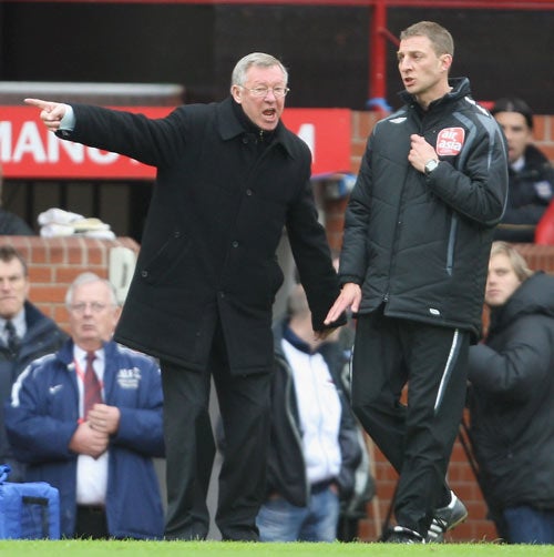 Ferguson (above) felt United had a spot-kick denied when Ronaldo was blocked by Sylvain Distin during the FA Cup deafeat against Portsmouth at Old Trafford