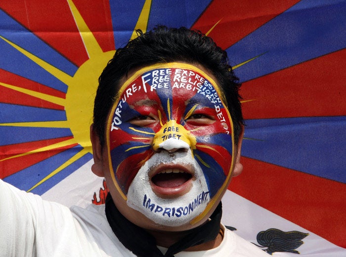 A Tibetan exile is defiant at a protest in the north-eastern Indian city of Siliguri