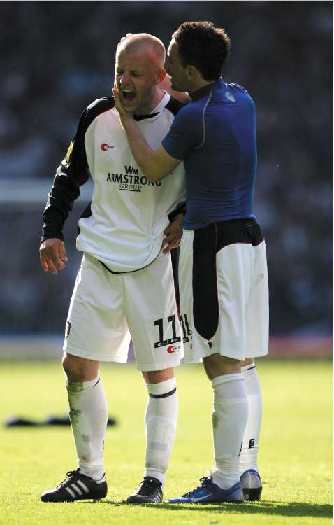 Gretna's Gavin Skelton (left) is inconsolable after the club lost to Hearts in the 2006 Scottish Cup final