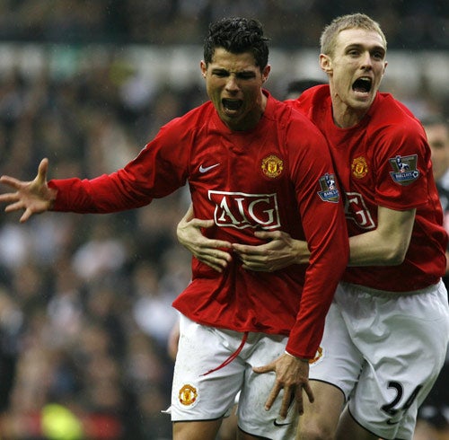 Ronaldo (left) celebrates his winning goal with team mate Darren Fletcher