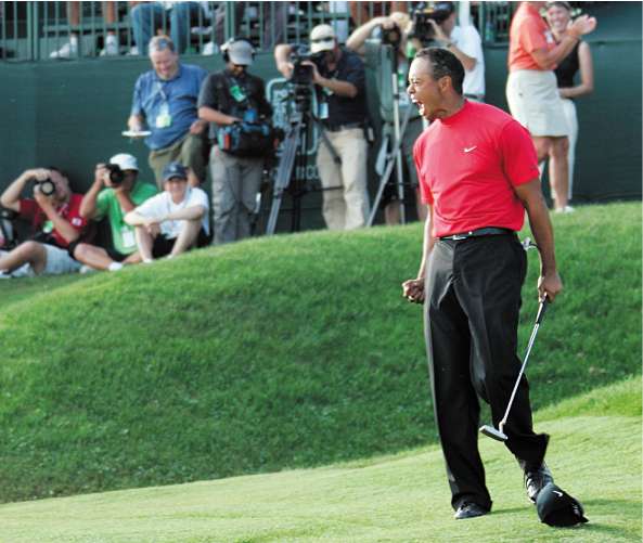 Woods celebrates on the 18th at Bay Hill after sinking an improbable 24-foot putt to win the Arnold Palmer Invitational - his seventh successive victory