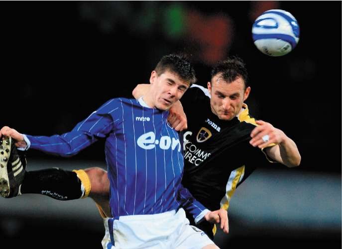 Riccardo Scimeca of Cardiff battles with Owen Garvan of Ipswich (left)