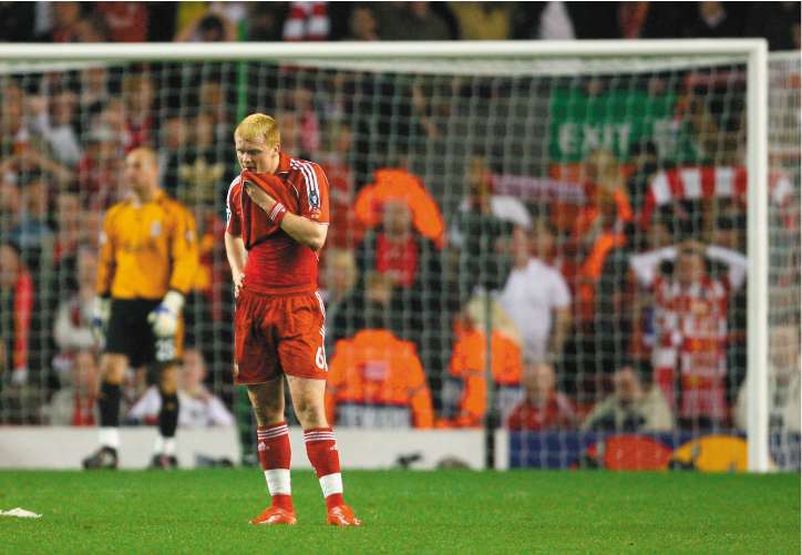 John Arne Riise cuts a lonely figure at the final whistle