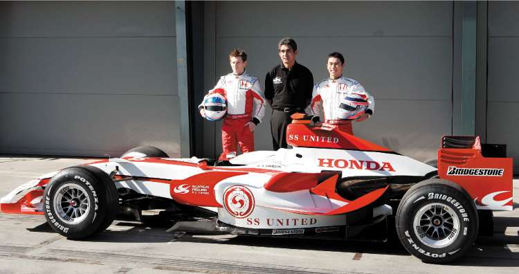 British driver Anthony Davidson (left) stands alongside his Super Aguri team principal, Aguri Suzuki, and team-mate Takuma Sato