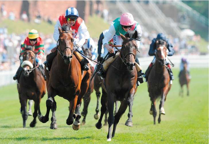 Doctor Fremantle and Ryan Moore (pink cap) capture the Chester Vase from All The Aces (left) yesterday