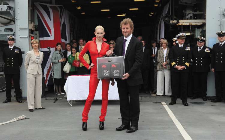 The novelist Sebastian Faulks receives the first copies of his new Bond novel from model Tuuli Shipster