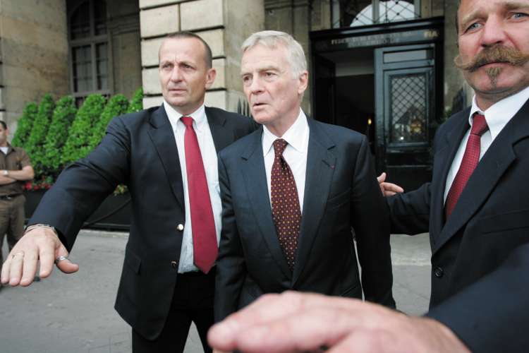 The president of the FIA, Max Mosley, outside the group's head office in Paris after surviving the vote