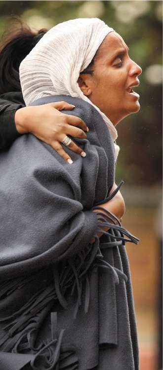 A woman, believed to be the mother of the murdered schoolgirl Arsema Dawit, cries out at the scene in Lambeth, south London