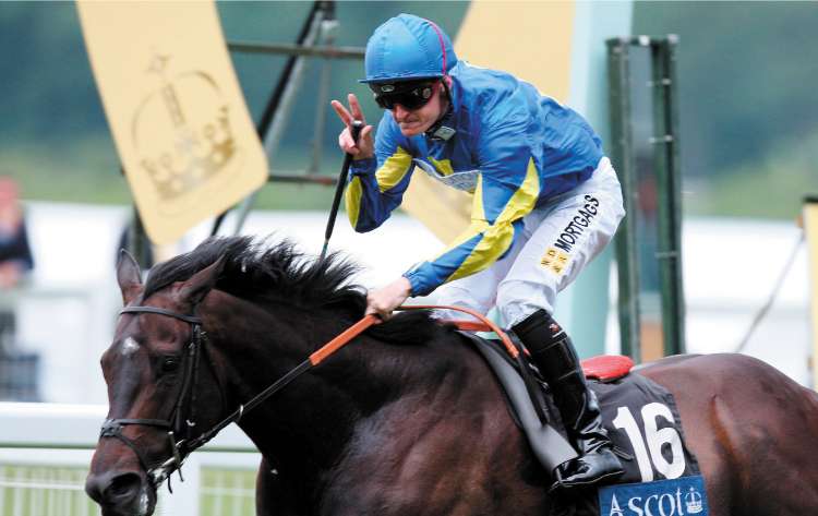 Steve Drowne celebrates his victory on Supaseus in the Wolferton Handicapat Royal Ascot