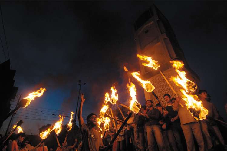 Kashmiri Muslims celebrate after the state government revoked the transfer of land to Hindus