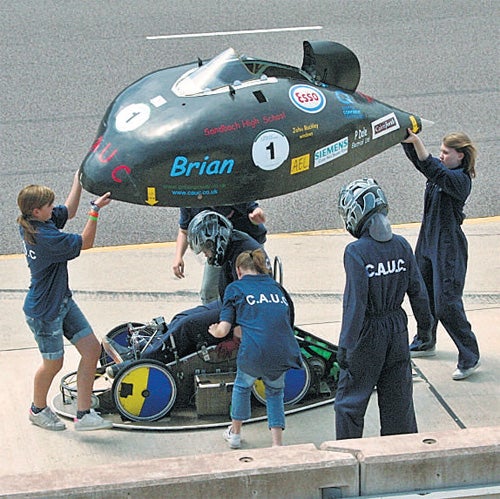 Lift off: the winning team with Brian, their electric car