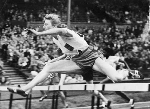 Blankers-Koen competing in the hurdles at the 1948 London Games (Getty)