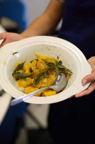 Spoon the sage leaves and butter over the gnocchi and season with ground pepper