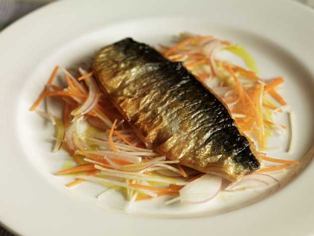 Place the fillets on the vegetables, skin side up and serve