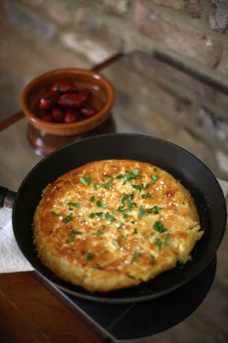 Use the simplest ingredients: really good fresh eggs and finely sliced cooked potatoes