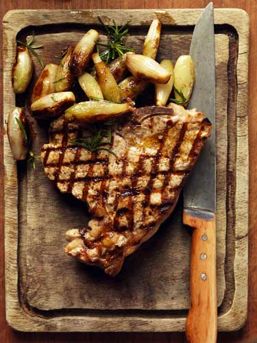 Serve on a carving board with the shallots and rosemary