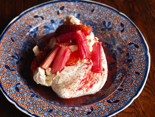 Spoon the crème fraiche into the meringue and spoon the rhubarb mixture over