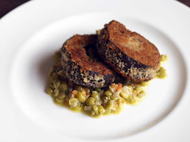 To serve, spoon the peas on to plates and arrange the lamb on top