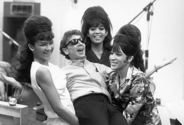 The Ronettes pose with Phil Spector in Los Angeles, 1963