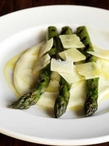 Place the asparagus on top of the potato and scatter with the shaved Parmesan