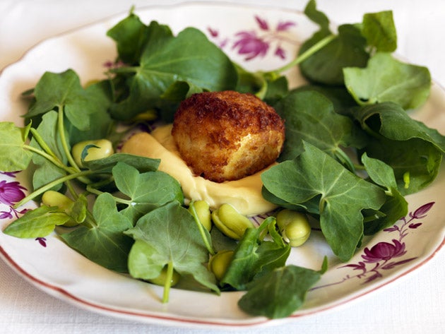 Spoon a blob of mayonnaise onto a serving plate, arrange the leaves and broad beans around, then place the eggs on the mayonnaise