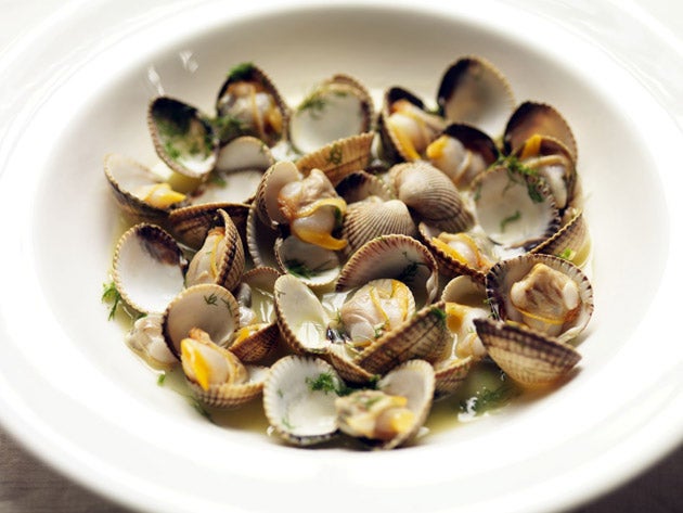 Spoon the cockles into warmed serving bowls and pour the butter over