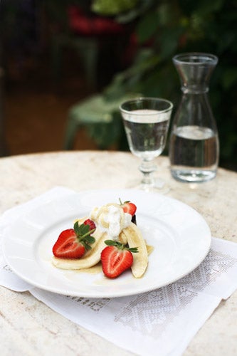 Spoon the ricotta over the bread, arrange the banana and strawberries on top and drizzle over the honey