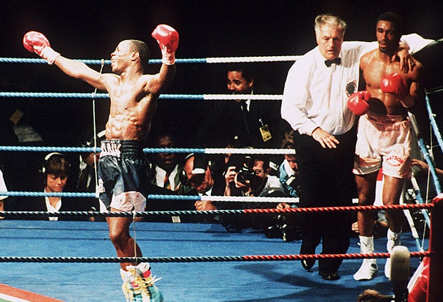 Chris Eubank celebrates after defeating Michael Watson in 1991