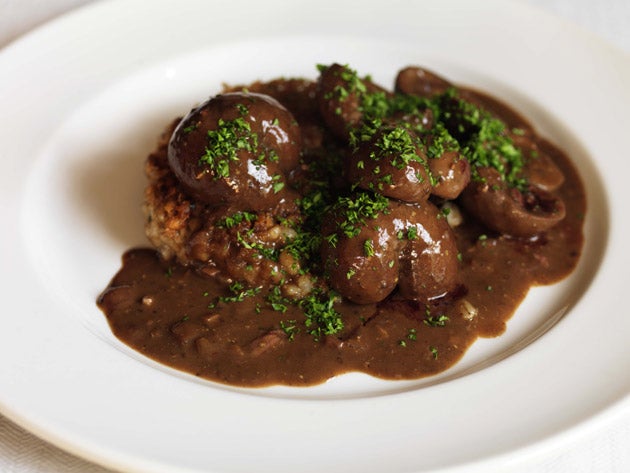 Lay the kidneys on top of the pearl-barley cakes and pour the sauce around