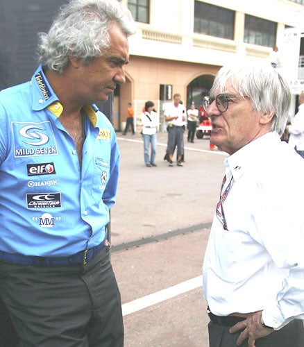 Bernie Ecclestone (right) apologised for his comments about Hitler and says a similar approach could have got Flavio Briatore (left) off the hook