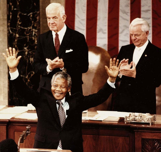 Nelson Mandela raises his arms to acknowledge appaluse from members of the Senate and House of Representatives in Washington DC in June 1990.